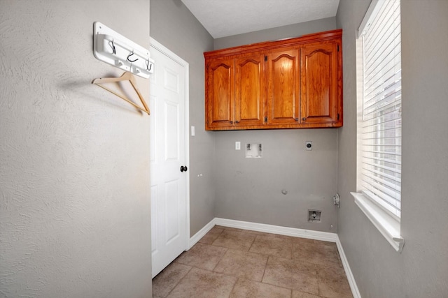 washroom with cabinets, hookup for a gas dryer, hookup for a washing machine, and electric dryer hookup