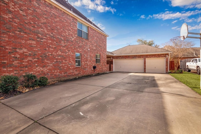 view of side of home featuring a garage