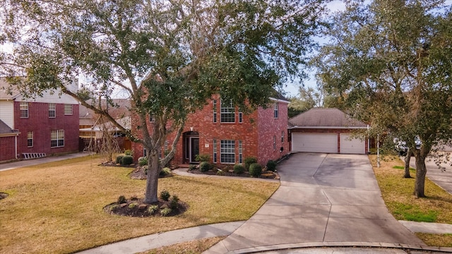 view of front of property with a garage and a front lawn