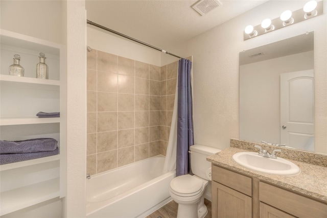 full bath with a textured ceiling, toilet, shower / tub combo, visible vents, and vanity