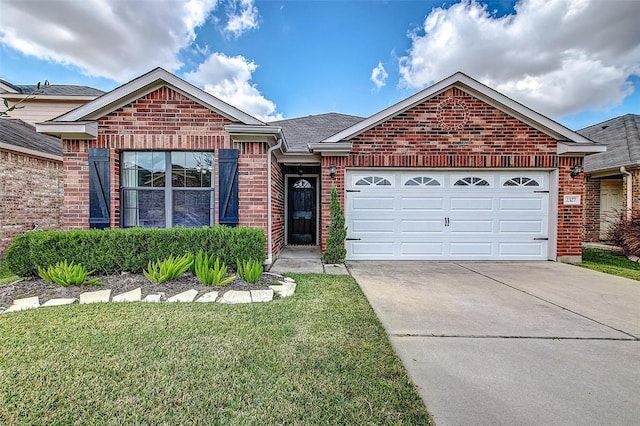 view of front of house with a garage and a front yard