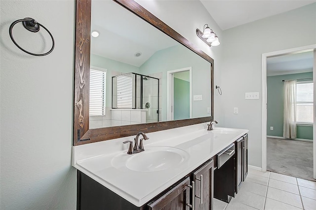 bathroom featuring vanity, tile patterned floors, and walk in shower