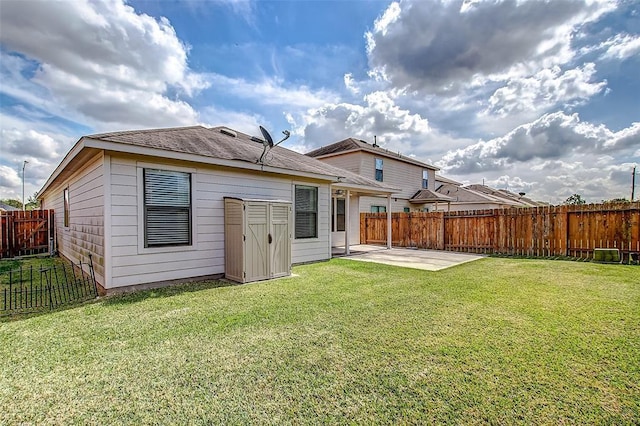 back of property with a patio and a lawn