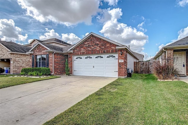 view of front of house featuring a garage and a front yard