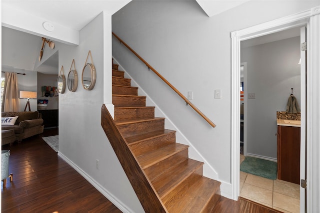 1382 Indian Hill Blvd, Livingston, TX 77351 - stairs featuring baseboards and wood finished floors