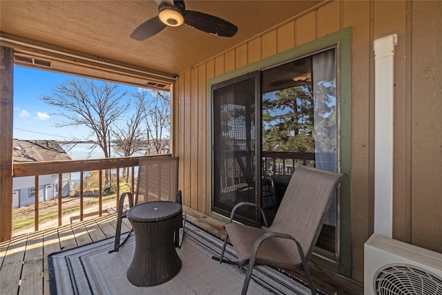 wooden deck with ceiling fan and ac unit