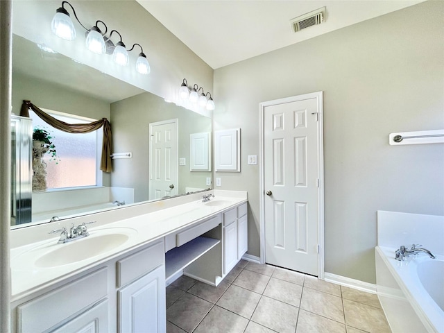 full bathroom with a garden tub, double vanity, a sink, and visible vents