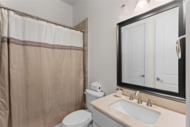 bathroom featuring a shower with curtain, vanity, and toilet