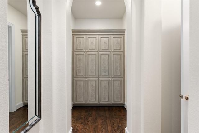 corridor with dark wood-type flooring