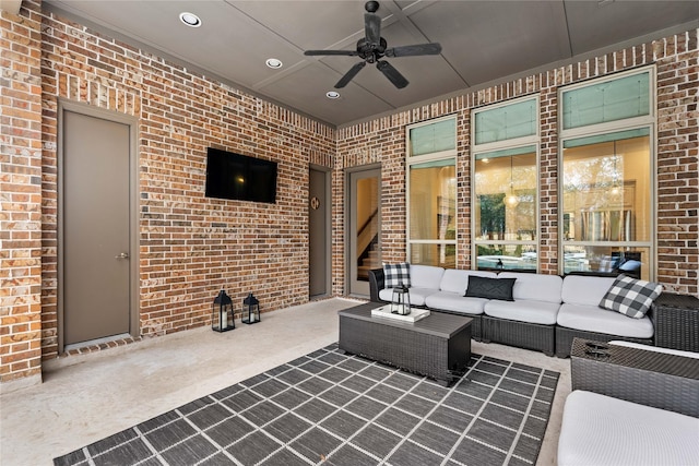 view of patio / terrace with ceiling fan and an outdoor living space