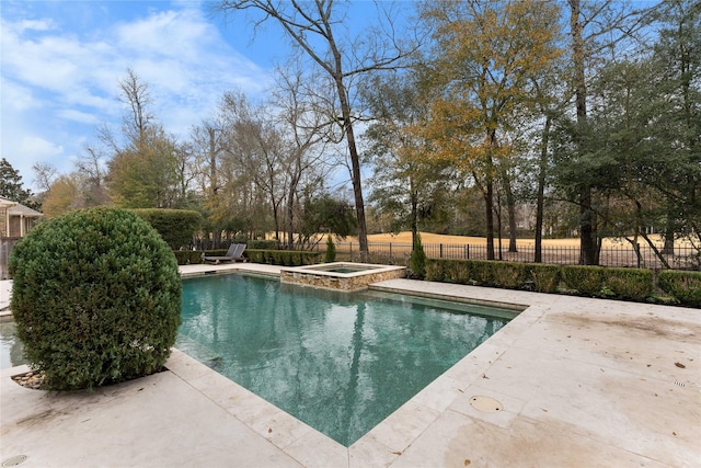 view of pool featuring an in ground hot tub and a patio