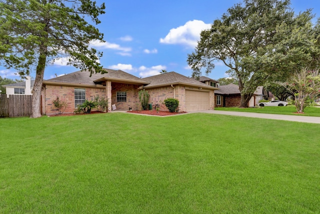 view of front of property with a garage and a front yard