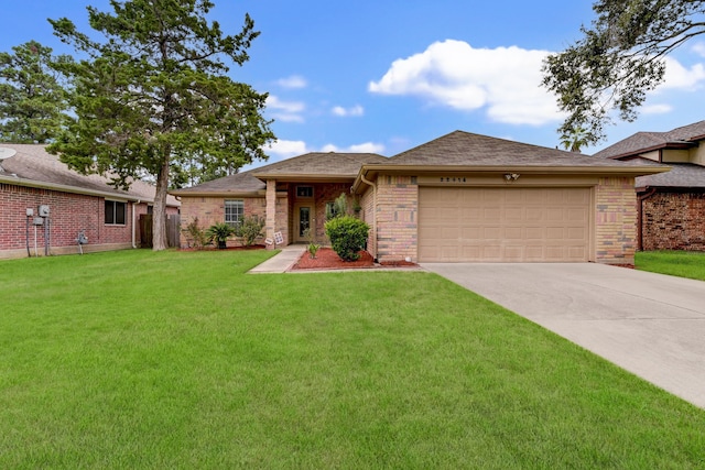 view of front facade with a garage and a front lawn