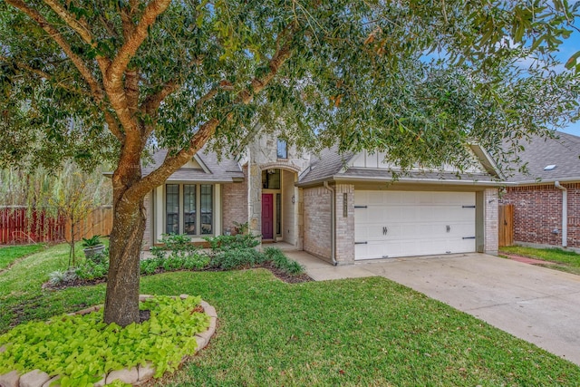 view of front of property with a garage and a front yard