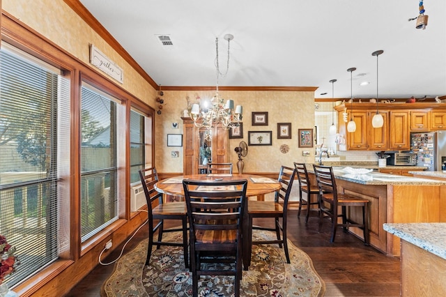 dining area featuring crown molding, an inviting chandelier, and dark wood-type flooring