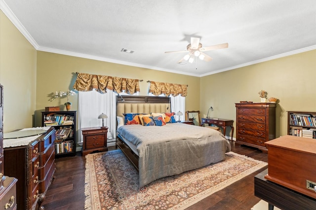 bedroom featuring dark wood-type flooring, ornamental molding, and ceiling fan