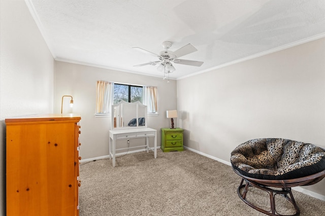 sitting room featuring crown molding, carpet floors, a textured ceiling, and ceiling fan