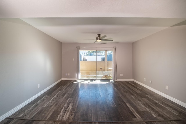 spare room featuring ceiling fan and dark hardwood / wood-style flooring