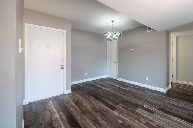 unfurnished dining area featuring dark hardwood / wood-style flooring