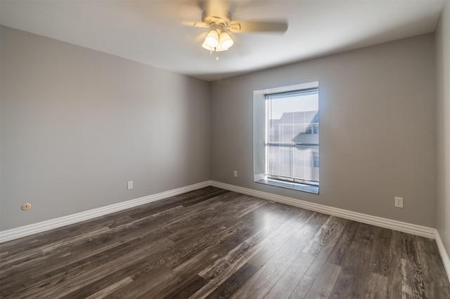 unfurnished room with ceiling fan and dark hardwood / wood-style flooring