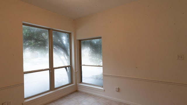 spare room featuring a wealth of natural light