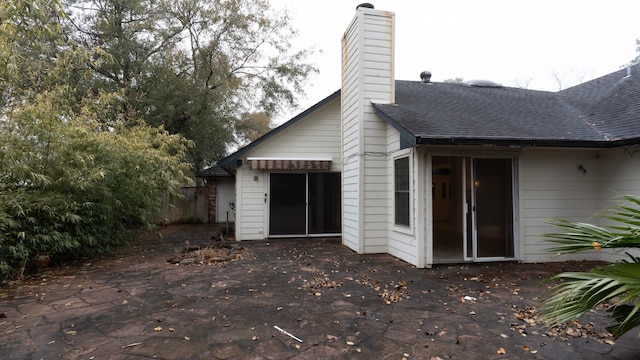 back of property featuring a patio area