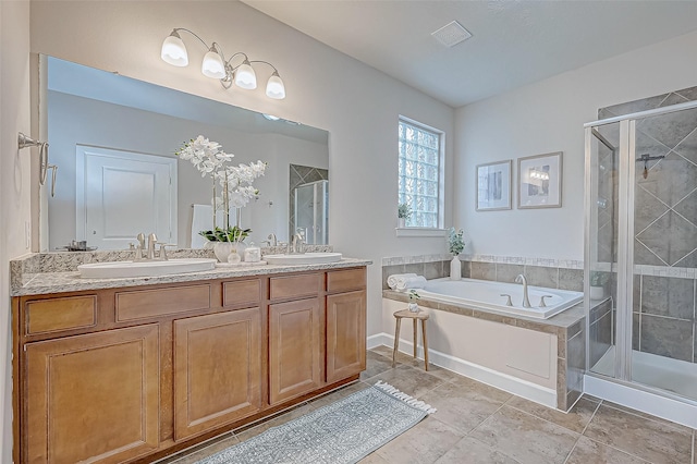 bathroom featuring shower with separate bathtub and vanity