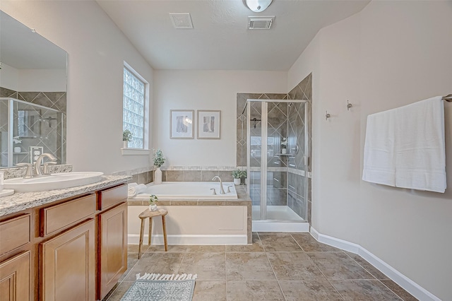 bathroom featuring vanity and separate shower and tub