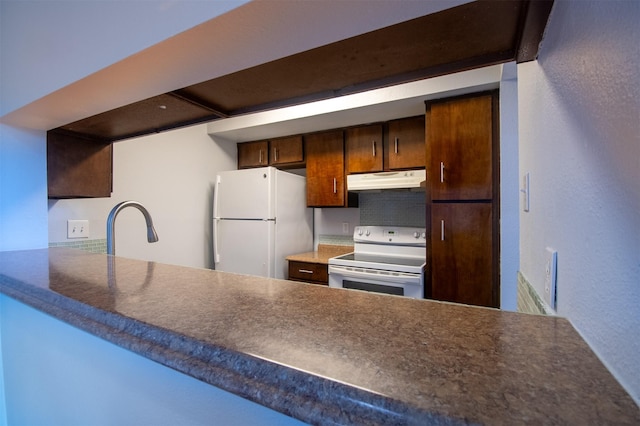 kitchen featuring sink and white appliances