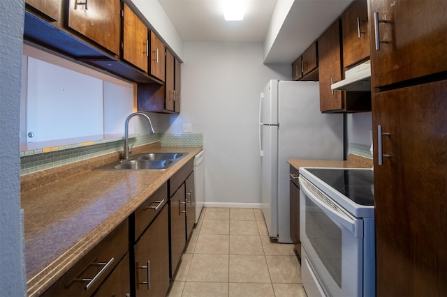 kitchen with sink, white appliances, backsplash, and light tile patterned flooring