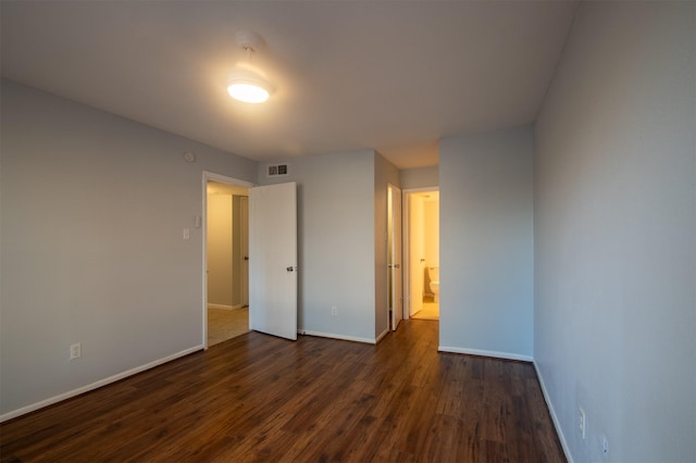 unfurnished bedroom featuring dark wood-type flooring