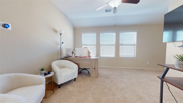 carpeted office space with ceiling fan and lofted ceiling