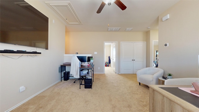 office with light carpet and ceiling fan