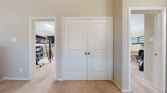 interior space featuring light carpet