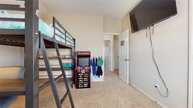 bedroom featuring light carpet