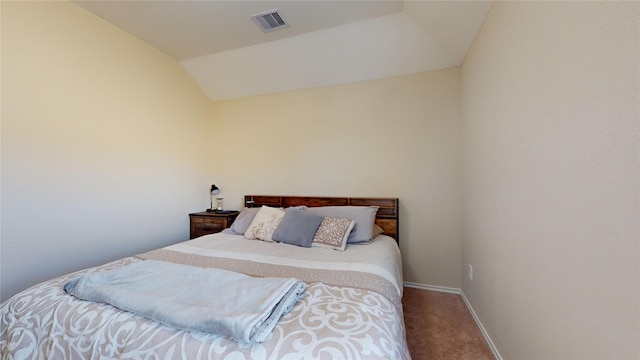 carpeted bedroom featuring lofted ceiling