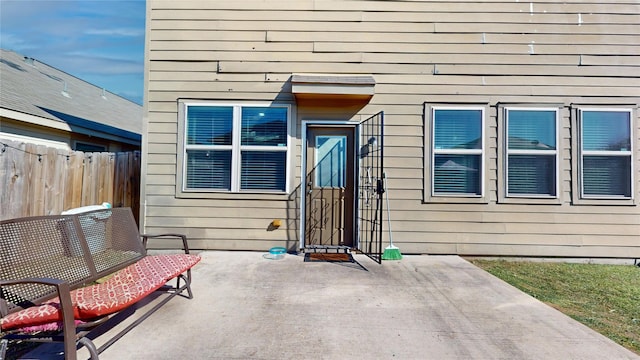 property entrance featuring a patio