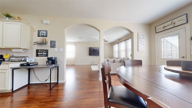 dining room featuring dark wood-type flooring and ceiling fan