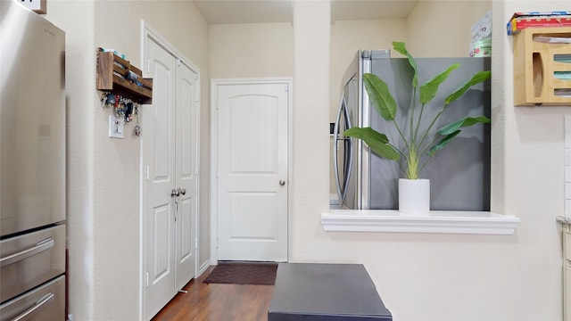 doorway with dark hardwood / wood-style flooring