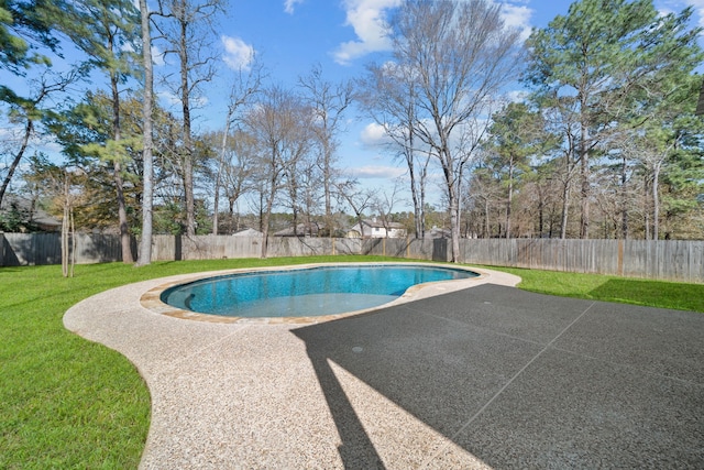 view of swimming pool with a patio area, a fenced backyard, a fenced in pool, and a yard