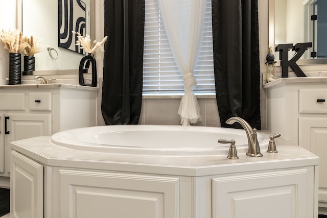 bathroom with vanity and a bathtub