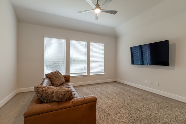 living area featuring ceiling fan and light hardwood / wood-style flooring