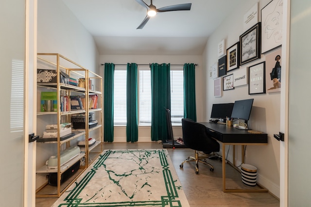 office featuring hardwood / wood-style floors, vaulted ceiling, and ceiling fan