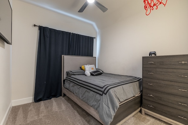 bedroom featuring light colored carpet and ceiling fan