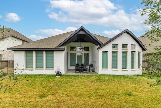 back of house featuring a lawn, a patio, and ceiling fan