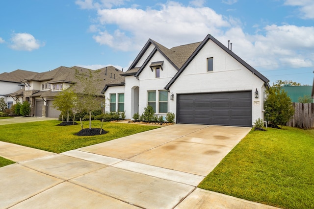 view of front of property with a garage and a front yard