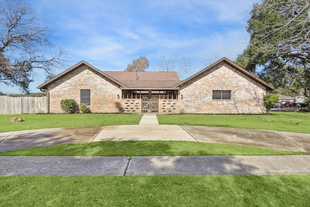 ranch-style house with a front yard