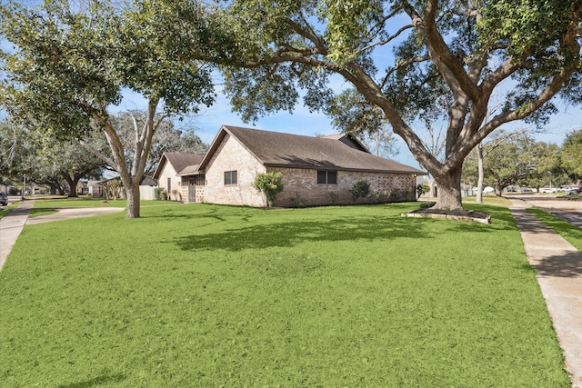 view of side of property with a yard