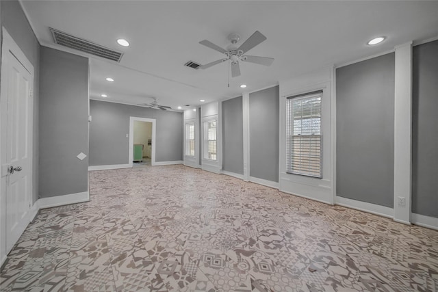 carpeted empty room with a healthy amount of sunlight and ceiling fan