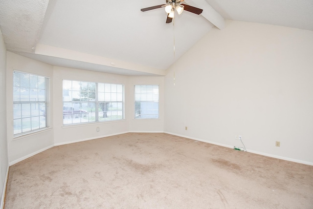 carpeted spare room featuring lofted ceiling with beams and ceiling fan